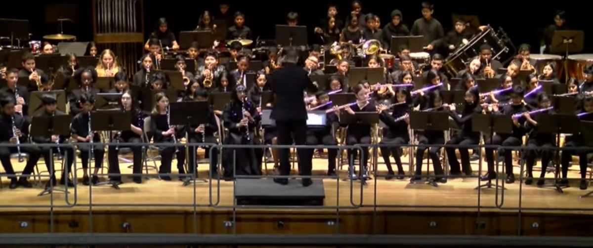 Picture of IMS 2023 winter band concert at JFK High School (photo on Youtube, screenshot by Pavithra) 