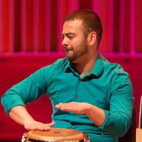 Mr. Vasquez playing his drums (from the press of Atlantic City)