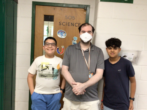 A picture of Mr. McDonough with staff reporters.