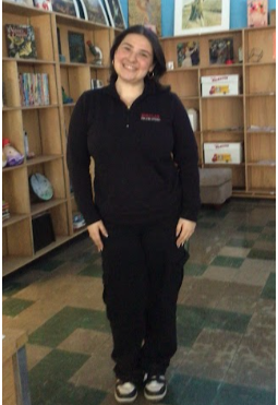 (Ms.Donnelly standing in the art room.)