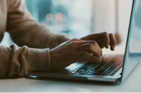 A tech professional working on a laptop, mirroring the daily workspace of Mohamed (Photo courtesy of Unsplash)
